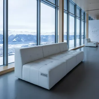 Аренда Диван белый стеганый из экокожи Cube на площадке Rosa Peak (2320м) — ART SPACE